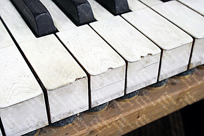 Old, chipped, stained ivory keytops prior to replacement